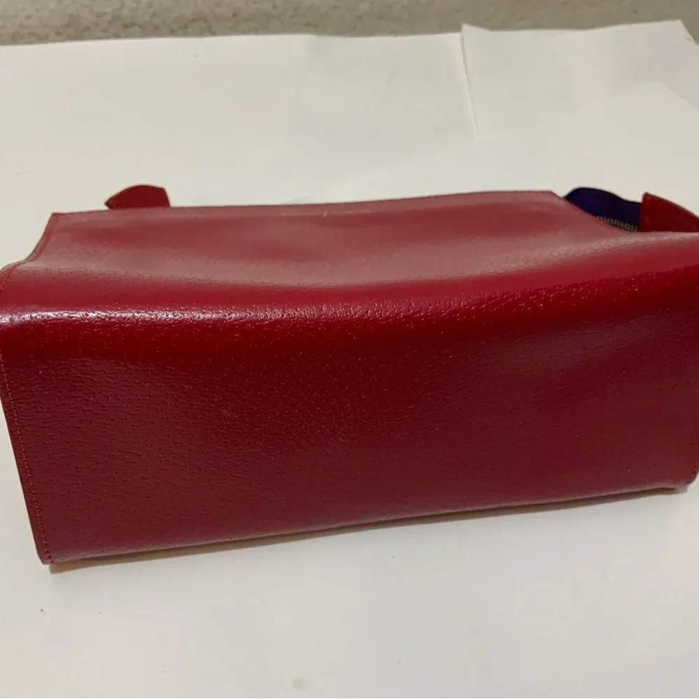 NWOT Aspinal of London red reptile cosmetic case.